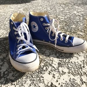 Royal blue Converse high tops.